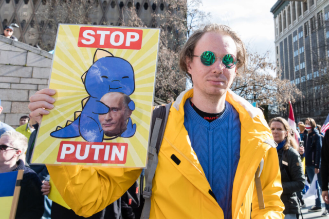 A sign reads, "Stop Putin."