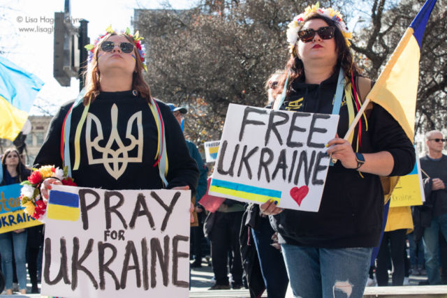 Signs read, "Pray for Ukraine" and "Free Ukraine"