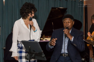 Darelle Holden and Dave Holden, Sr. sing together.