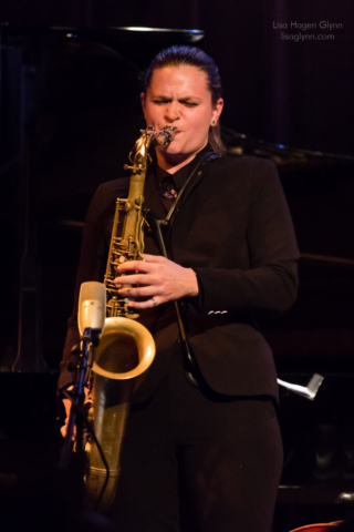 Nicole Glover on tenor saxophone.