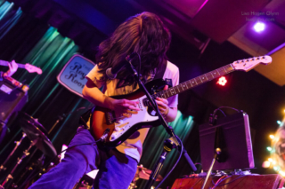 Caspian Coberly on guitar