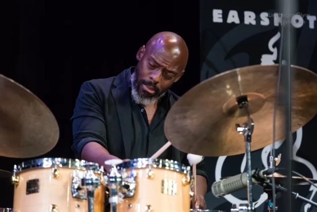 E. J. Strickland (drums)